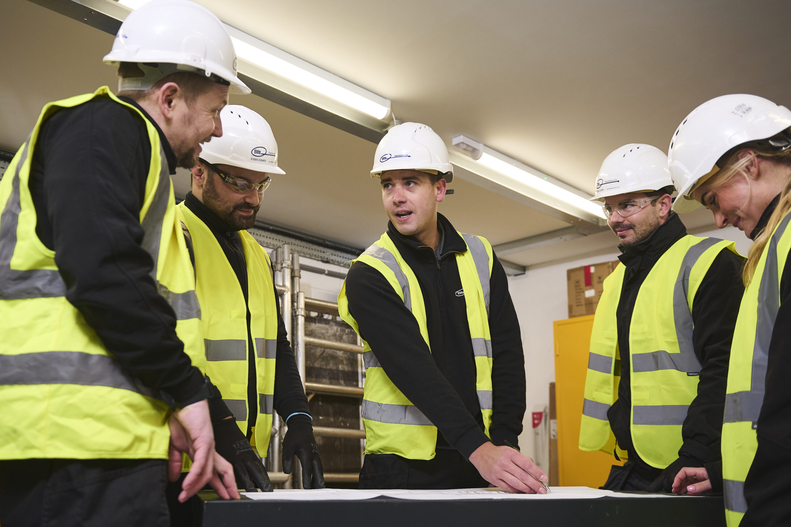 Image of a group of engineers having a site meeting